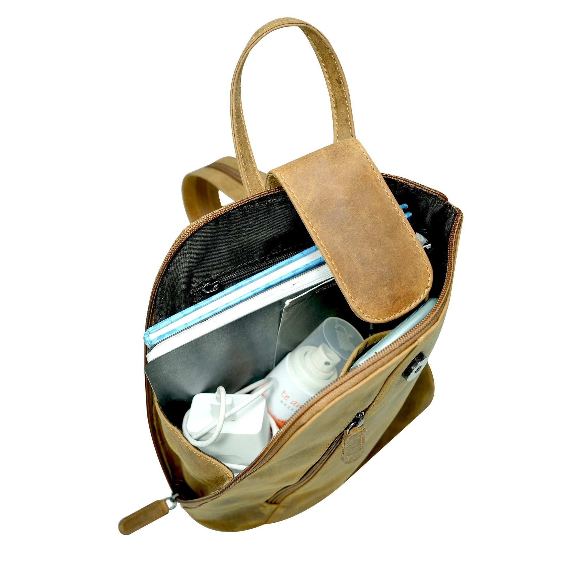 Open camel leather bag with items inside on a white background