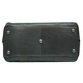 Brown leather bag bottom view silver studs on a white background