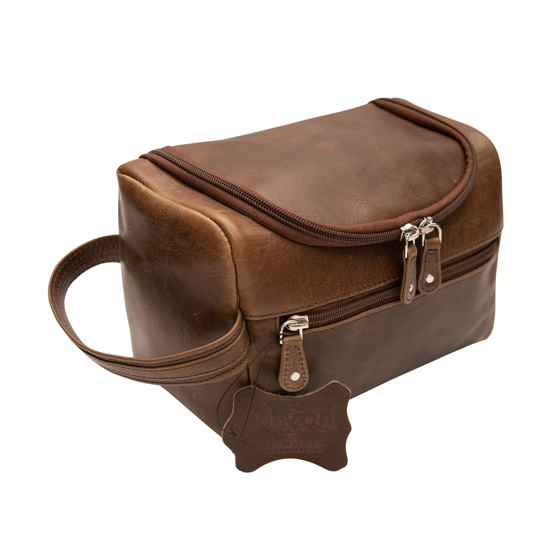 A medium-sized brown leather toiletry bag with zip pockets and a fixed short side handle.