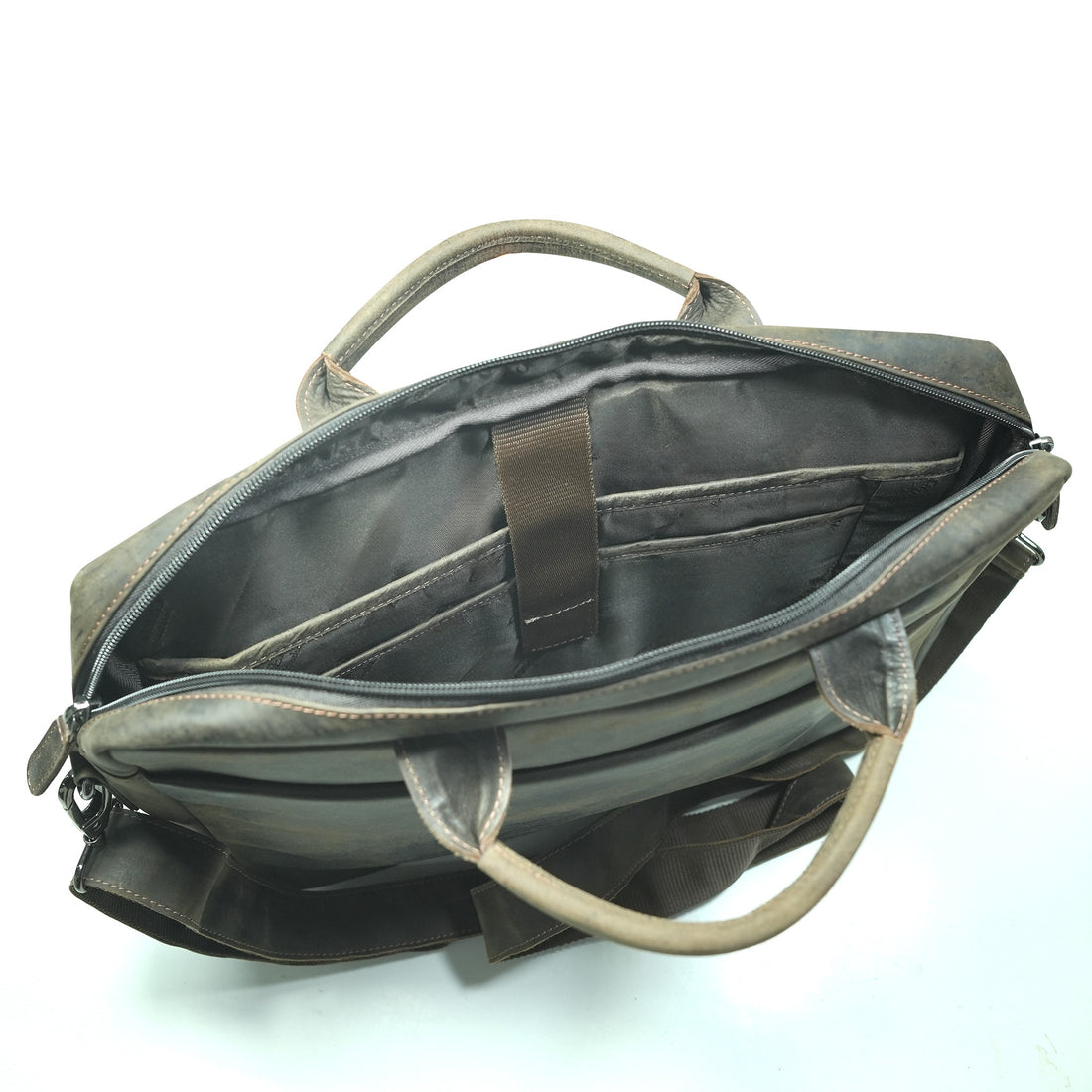 Brown leather briefcase with shoulder strap on a white background