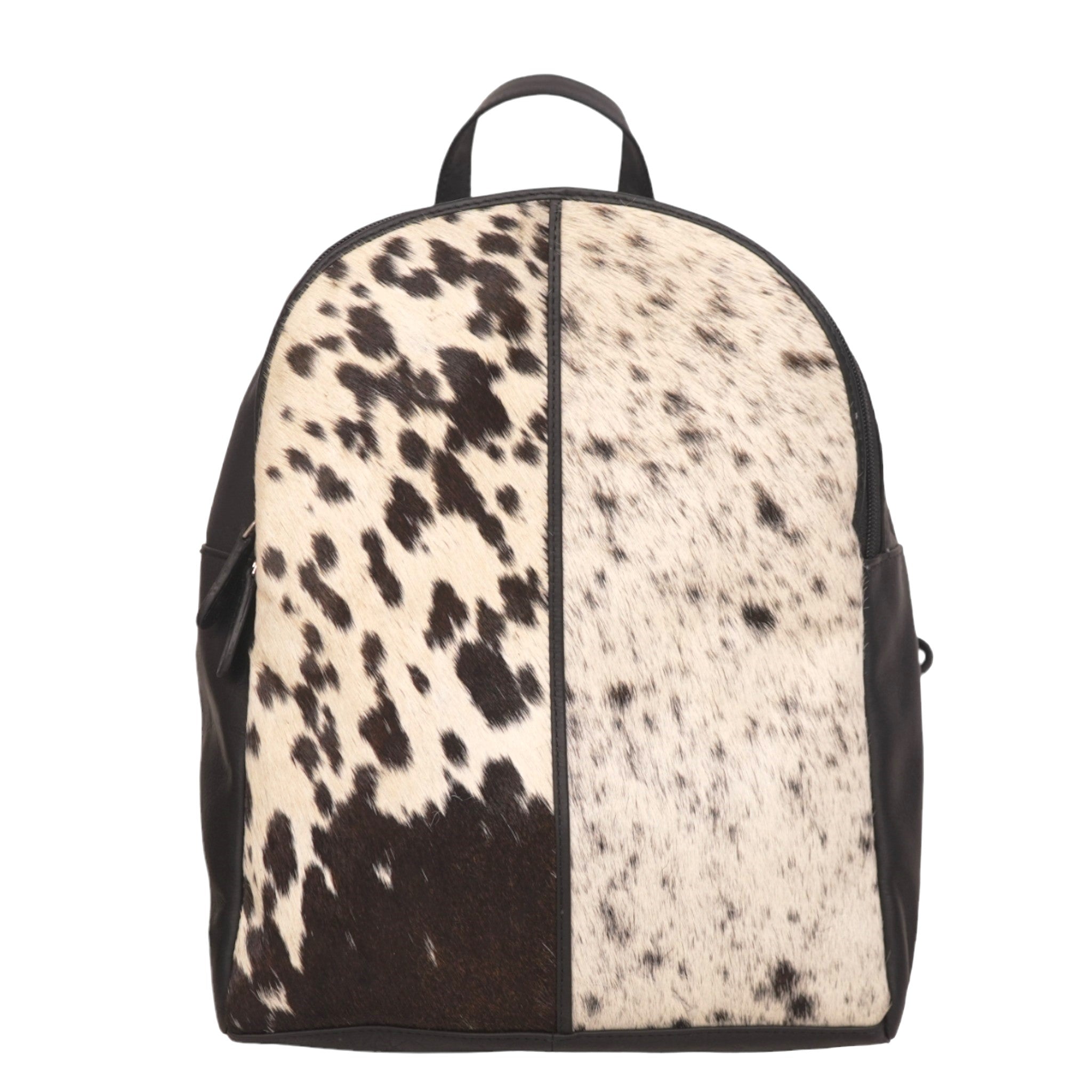 A medium-sized backpack featuring a hairon design with black and white cowhide pattern, solid black straps, and metal hardware.