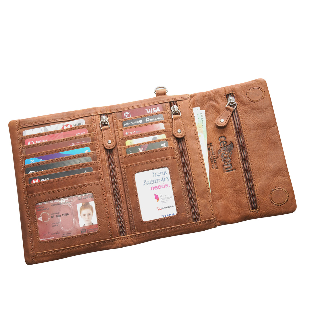 Tan leather clutch bag with a strap on a white background